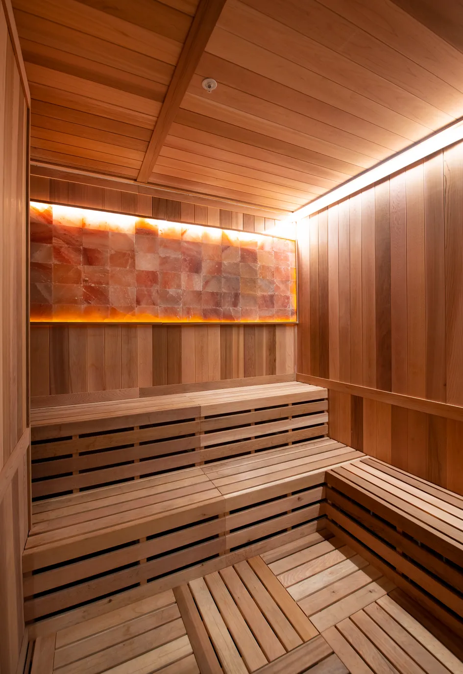 Traditional dry sauna interior at Lake Nona Performance Club — premium heat therapy and recovery amenity included with every gym membership in Lake Nona, FL